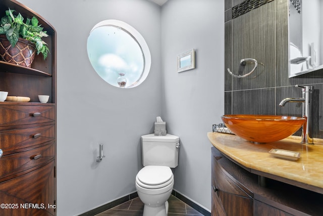 2279 Seminole Rd Unit 11, Atlantic Beach, FL 32233 - bathroom featuring vanity, toilet, and baseboards