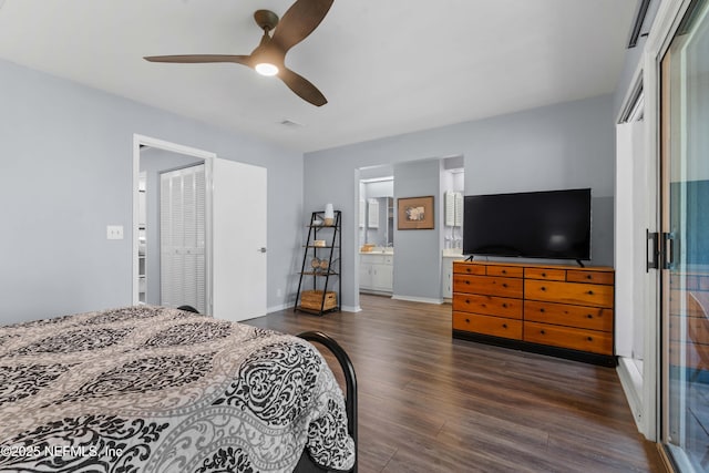 2279 Seminole Rd Unit 11, Atlantic Beach, FL 32233 - bedroom featuring dark wood-style floors, a closet, baseboards, a ceiling fan, and ensuite bath