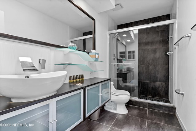 2279 Seminole Rd Unit 11, Atlantic Beach, FL 32233 - bathroom featuring toilet, a shower stall, vanity, and tile patterned flooring