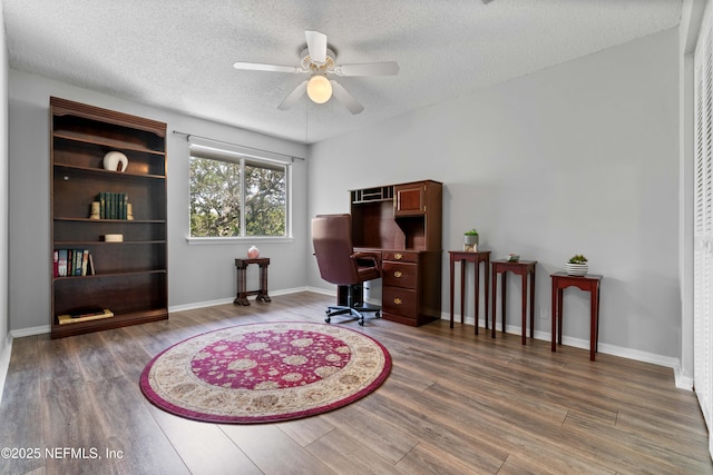 2279 Seminole Rd Unit 11, Atlantic Beach, FL 32233 - office area with wood finished floors, ceiling fan, a textured ceiling, and baseboards