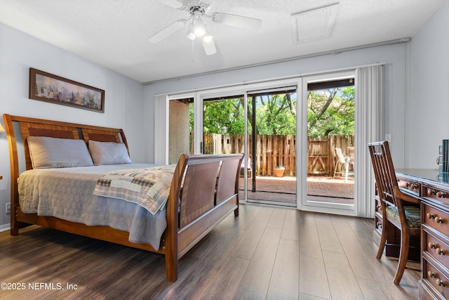 2279 Seminole Rd Unit 11, Atlantic Beach, FL 32233 - bedroom with access to exterior, multiple windows, wood finished floors, a textured ceiling, and ceiling fan