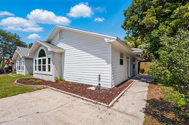 257 Jasmine St, Atlantic Beach, FL 32233 - view of property exterior with a patio area