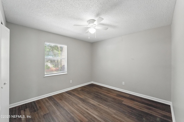 257 Jasmine St, Atlantic Beach, FL 32233 - unfurnished room featuring dark wood-style floors, ceiling fan, baseboards, and a textured ceiling
