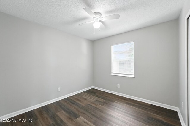 257 Jasmine St, Atlantic Beach, FL 32233 - empty room featuring dark wood-type flooring, ceiling fan, baseboards, and a textured ceiling