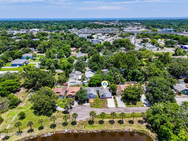 257 Jasmine St, Atlantic Beach, FL 32233 - aerial perspective of suburban area with a nearby body of water and a tree filled landscape