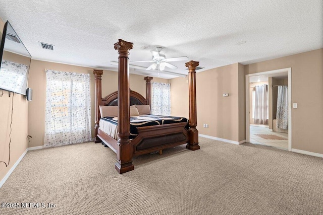 17 Rollins Ave, Saint Augustine, FL 32084 - bedroom featuring carpet, baseboards, a textured ceiling, a ceiling fan, and ornate columns