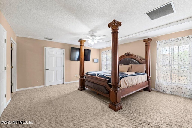 17 Rollins Ave, Saint Augustine, FL 32084 - carpeted bedroom with multiple windows, decorative columns, baseboards, a textured ceiling, and a ceiling fan