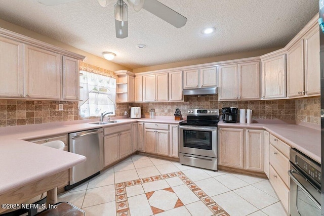 17 Rollins Ave, Saint Augustine, FL 32084 - kitchen featuring stainless steel appliances, a sink, light brown cabinetry, under cabinet range hood, and a ceiling fan
