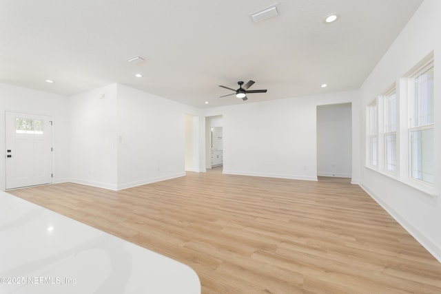 1873 Openwoods Rd, Middleburg, FL 32068 - unfurnished living room featuring light wood-style floors, ceiling fan, recessed lighting, and baseboards