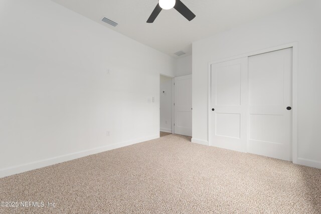 1873 Openwoods Rd, Middleburg, FL 32068 - unfurnished bedroom with light colored carpet, a closet, baseboards, and ceiling fan