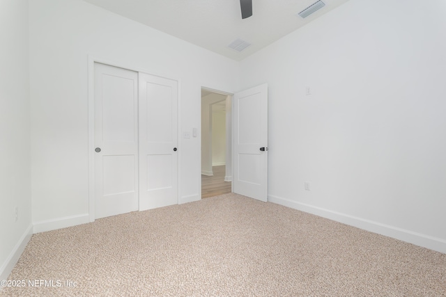 1873 Openwoods Rd, Middleburg, FL 32068 - unfurnished bedroom with carpet floors, a closet, baseboards, and a ceiling fan
