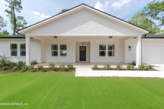 1873 Openwoods Rd, Middleburg, FL 32068 - view of front facade with a front yard, a garage, covered porch, and concrete driveway