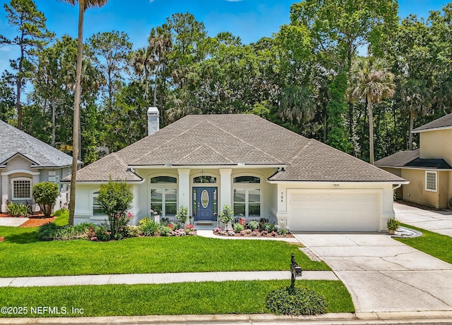 784 Mill Stream Rd, Ponte Vedra Beach, FL 32082 - view of front of home featuring a garage, driveway, a front lawn, and roof with shingles