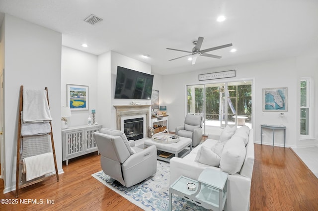 784 Mill Stream Rd, Ponte Vedra Beach, FL 32082 - living area with ceiling fan, wood finished floors, a glass covered fireplace, recessed lighting, and baseboards