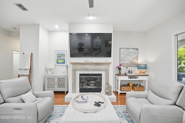 784 Mill Stream Rd, Ponte Vedra Beach, FL 32082 - living room featuring wood finished floors, a glass covered fireplace, and ceiling fan
