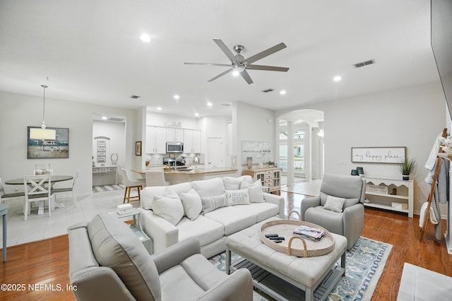 784 Mill Stream Rd, Ponte Vedra Beach, FL 32082 - living room with arched walkways, ceiling fan, baseboards, recessed lighting, and decorative columns