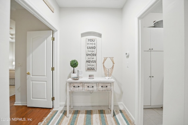 784 Mill Stream Rd, Ponte Vedra Beach, FL 32082 - hallway with baseboards and light wood finished floors