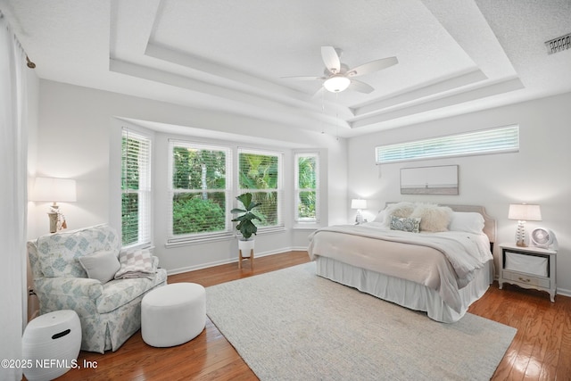 784 Mill Stream Rd, Ponte Vedra Beach, FL 32082 - bedroom featuring a raised ceiling, wood finished floors, ceiling fan, and baseboards