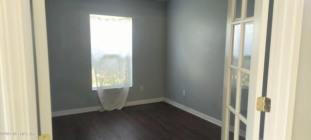 2340 Commodores Club Blvd, Saint Augustine, FL 32080 - empty room with dark wood finished floors and baseboards