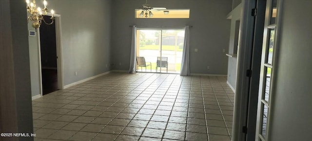 2340 Commodores Club Blvd, Saint Augustine, FL 32080 - spare room featuring baseboards, ceiling fan, and a chandelier