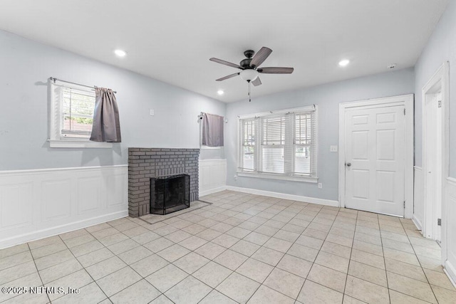 4537 Springfield Blvd, Jacksonville, FL 32206 - unfurnished living room with ceiling fan, plenty of natural light, a brick fireplace, recessed lighting, and light tile patterned flooring
