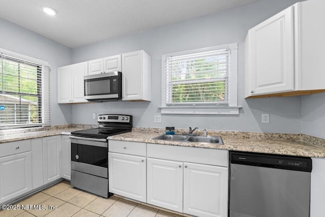 4537 Springfield Blvd, Jacksonville, FL 32206 - kitchen with appliances with stainless steel finishes, a sink, healthy amount of natural light, light countertops, and recessed lighting