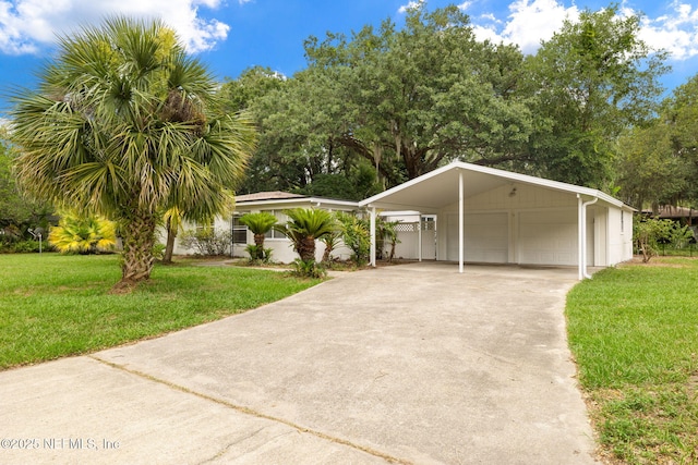 1927 Lakewood Cir N, Jacksonville, FL 32207 - view of front of house with a front lawn and a detached garage