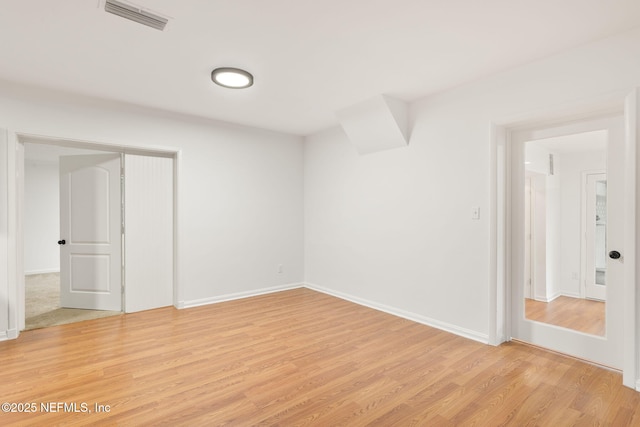 1927 Lakewood Cir N, Jacksonville, FL 32207 - empty room with light wood-style floors and baseboards