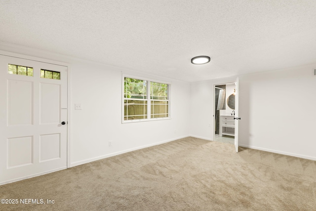 1927 Lakewood Cir N, Jacksonville, FL 32207 - carpeted spare room featuring a textured ceiling and baseboards