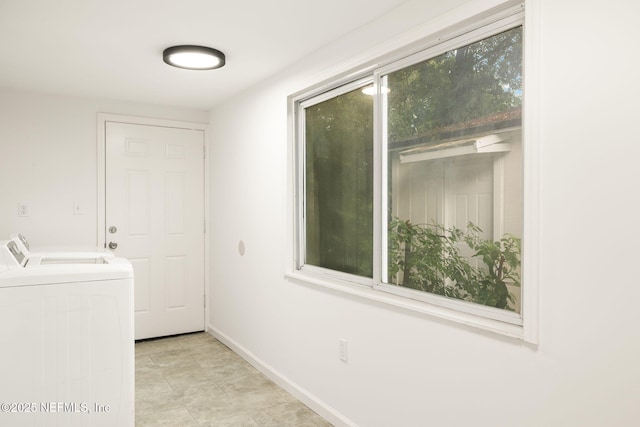 1927 Lakewood Cir N, Jacksonville, FL 32207 - washroom featuring separate washer and dryer and baseboards