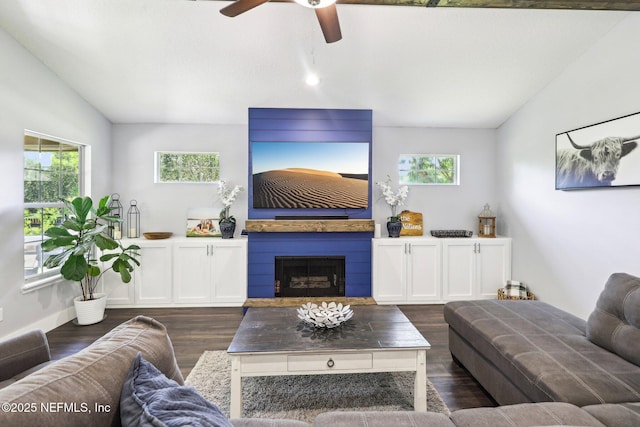 1708 Bridled Tern Ct, Fleming Island, FL 32003 - living room featuring lofted ceiling, ceiling fan, dark wood-style flooring, and a fireplace
