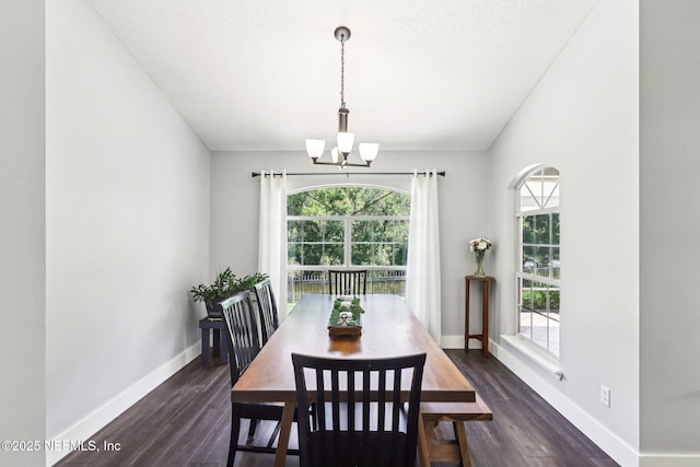 1708 Bridled Tern Ct, Fleming Island, FL 32003 - dining room with a chandelier, dark wood-type flooring, and baseboards