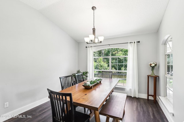 1708 Bridled Tern Ct, Fleming Island, FL 32003 - dining space with a chandelier, dark wood-type flooring, baseboards, and vaulted ceiling