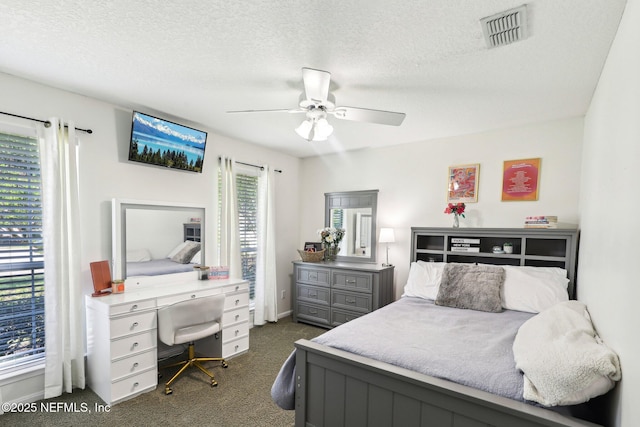 1708 Bridled Tern Ct, Fleming Island, FL 32003 - bedroom featuring dark colored carpet, ceiling fan, and a textured ceiling