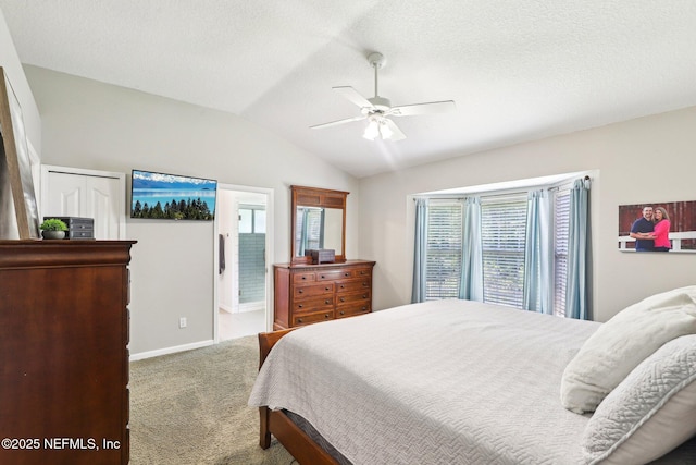 1708 Bridled Tern Ct, Fleming Island, FL 32003 - bedroom with vaulted ceiling, carpet flooring, baseboards, a ceiling fan, and a textured ceiling