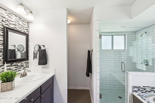 1708 Bridled Tern Ct, Fleming Island, FL 32003 - full bathroom with vanity, a stall shower, tasteful backsplash, tile patterned floors, and a garden tub