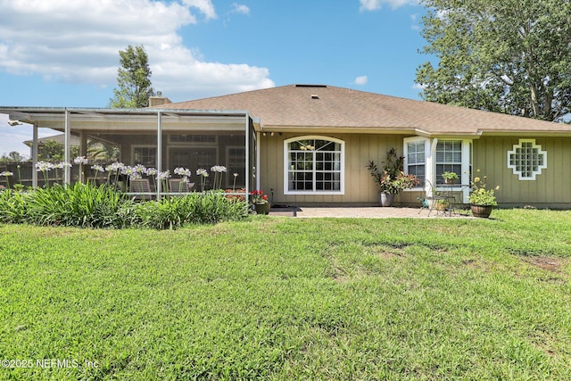 1708 Bridled Tern Ct, Fleming Island, FL 32003 - back of property with a lawn, a sunroom, and a patio area