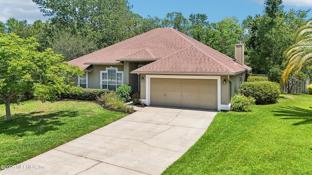 1708 Bridled Tern Ct, Fleming Island, FL 32003 - ranch-style home featuring stucco siding, an attached garage, driveway, and a front lawn