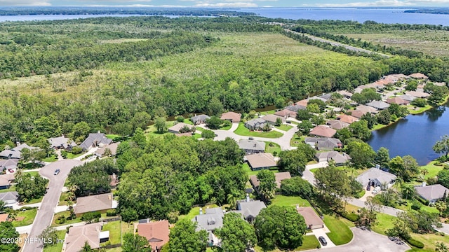 1708 Bridled Tern Ct, Fleming Island, FL 32003 - aerial view of residential area featuring a large body of water and a heavily wooded area