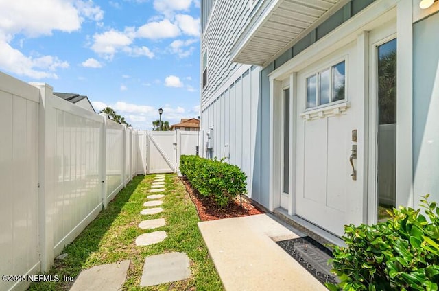 2189 2nd St S, Jacksonville Beach, FL 32250 - entrance to property with board and batten siding and a gate