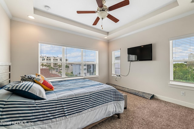 2189 2nd St S, Jacksonville Beach, FL 32250 - bedroom with multiple windows, a raised ceiling, carpet, recessed lighting, and ornamental molding