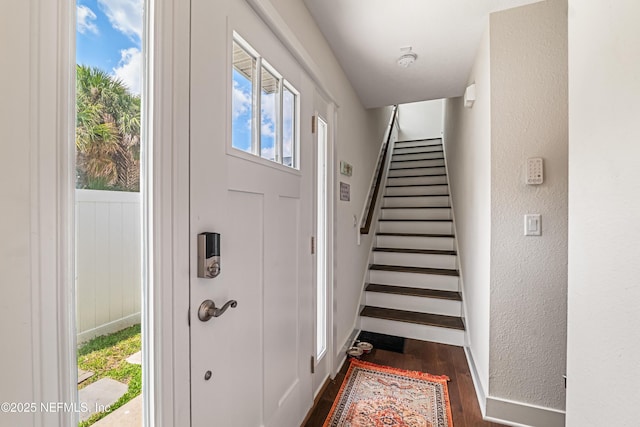 2189 2nd St S, Jacksonville Beach, FL 32250 - foyer featuring dark wood-style flooring, stairway, and a textured wall