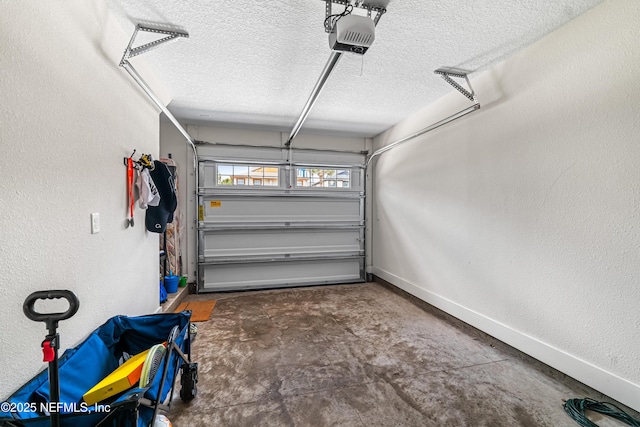 2189 2nd St S, Jacksonville Beach, FL 32250 - garage with a garage door opener and baseboards