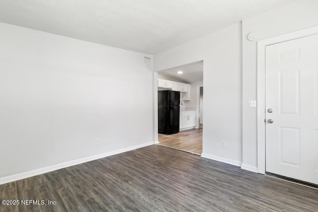 4249 Lockhart Dr, Jacksonville, FL 32209 - empty room featuring dark wood-style floors, baseboards, a smoke detector, and recessed lighting