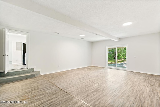 4249 Lockhart Dr, Jacksonville, FL 32209 - unfurnished room featuring wood finished floors, a textured ceiling, beam ceiling, baseboards, and recessed lighting
