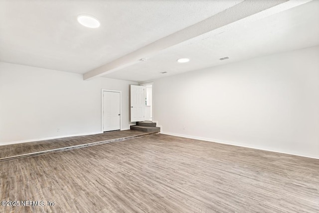 4249 Lockhart Dr, Jacksonville, FL 32209 - spare room featuring wood finished floors, baseboards, and beam ceiling