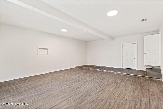 4249 Lockhart Dr, Jacksonville, FL 32209 - spare room with wood finished floors, baseboards, beamed ceiling, and recessed lighting