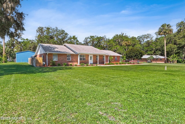 133 Divi Divi Dr, San Mateo, FL 32187 - single story home with a front lawn and brick siding