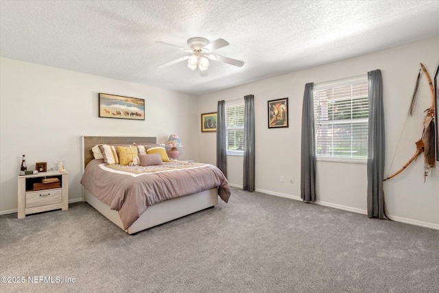 133 Divi Divi Dr, San Mateo, FL 32187 - bedroom featuring a textured ceiling, carpet floors, a ceiling fan, and baseboards