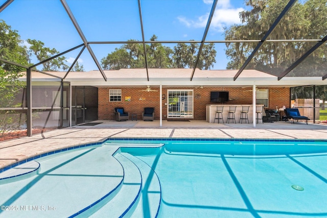 133 Divi Divi Dr, San Mateo, FL 32187 - swimming pool with a patio, glass enclosure, and a ceiling fan